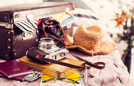 Travel Accessories on a Bed